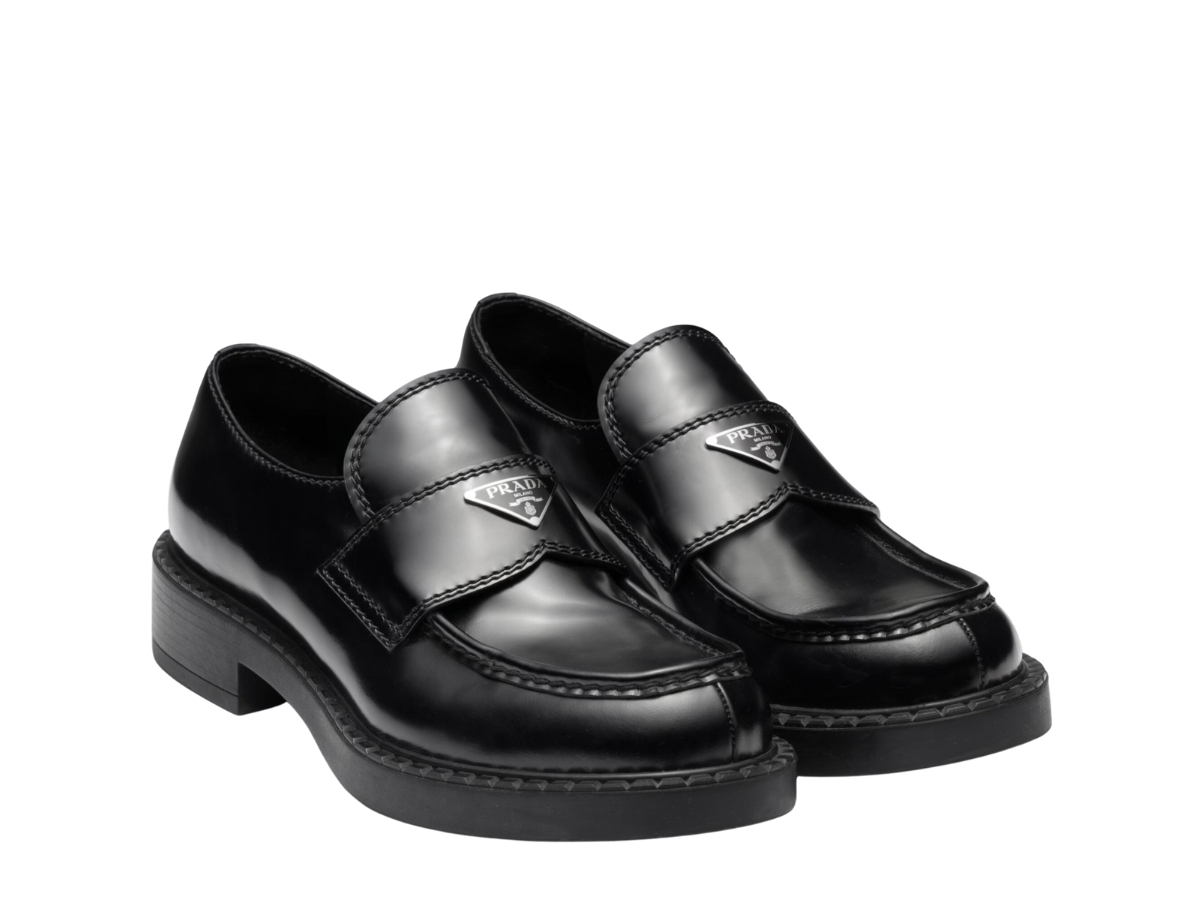 https://d2cva83hdk3bwc.cloudfront.net/prada-chocolate-patent-leather-loafers-in-rubber-monobloc-sole-with-enameled-metal-triangle-logo-black-2.jpg