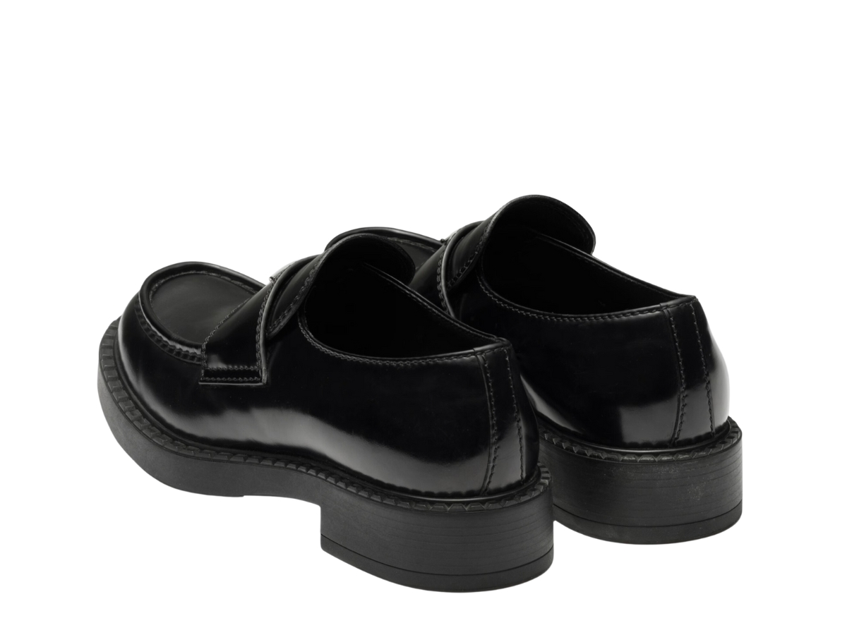 https://d2cva83hdk3bwc.cloudfront.net/prada-chocolate-patent-leather-loafers-in-rubber-monobloc-sole-with-enameled-metal-triangle-logo-black-3.jpg