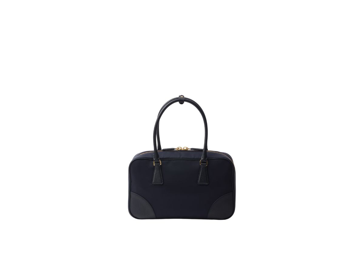 https://d2cva83hdk3bwc.cloudfront.net/prada-re-edition-1978-medium-in-re-nylon-and-saffiano-leather-two-handle-bag-with-metal-hardware-navy-3.jpg