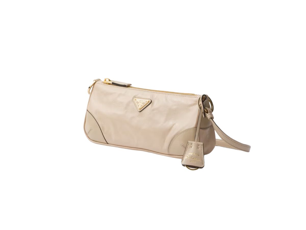https://d2cva83hdk3bwc.cloudfront.net/prada-re-edition-2002-small-leather-shoulder-bag-in-brushed-leather-with-metal-hardware-and-enameled-metal-triangle-logo-travertine-2.jpg