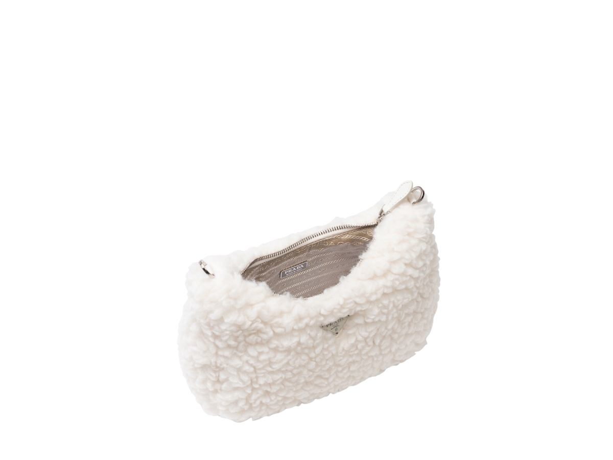 https://d2cva83hdk3bwc.cloudfront.net/prada-re-edition-2005-mini-bag-in-fur-effect-wool-and-cashmere-with-metal-hardware-natural-3.jpg