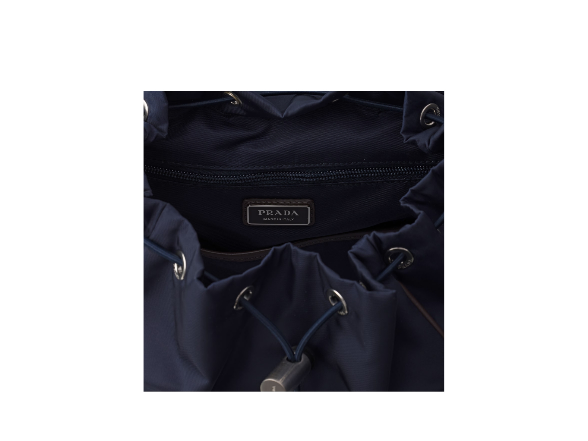 https://d2cva83hdk3bwc.cloudfront.net/prada-re-nylon-and-leather-backpack-in-recycled-polyamide-with-suede-bottom-blue-and-coffee-4.jpg