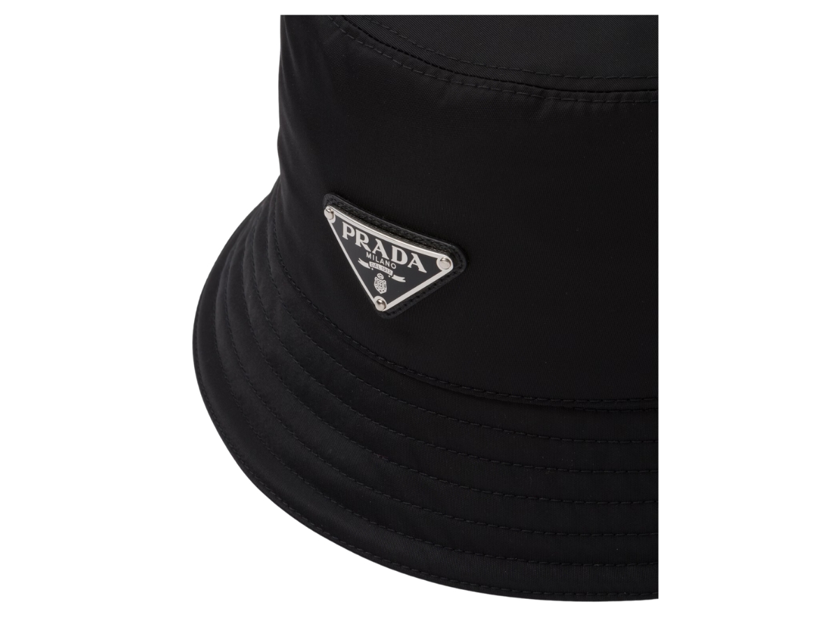 https://d2cva83hdk3bwc.cloudfront.net/prada-re-nylon-bucket-hat-in-cotton-lining-with-enameled-metal-triangle-logo-black-3.jpg