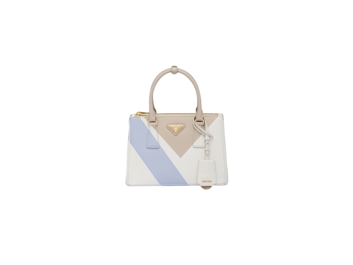 https://d2cva83hdk3bwc.cloudfront.net/prada-small-prada-galleria-saffiano-special-edition-bag-with-enameled-metal-triangle-logo-desert-white-1.jpg