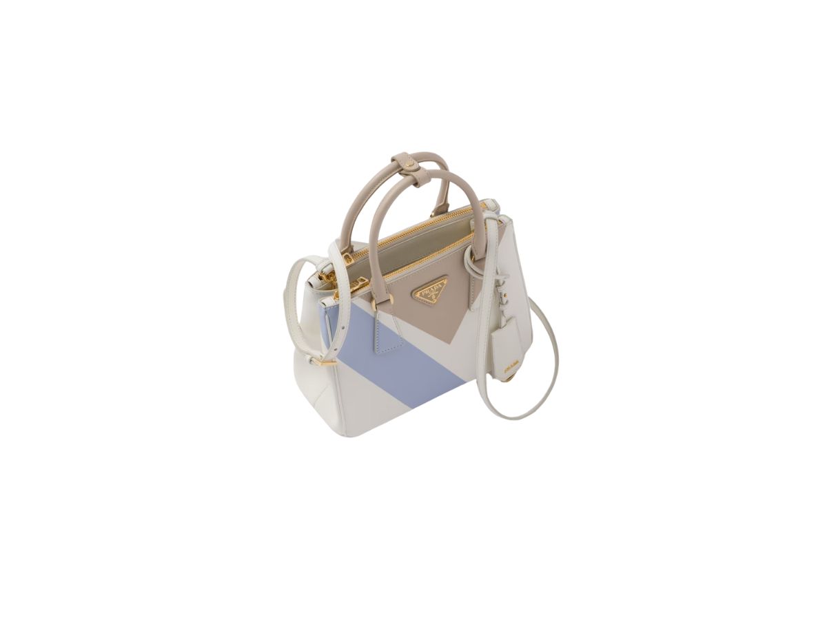 https://d2cva83hdk3bwc.cloudfront.net/prada-small-prada-galleria-saffiano-special-edition-bag-with-enameled-metal-triangle-logo-desert-white-2.jpg