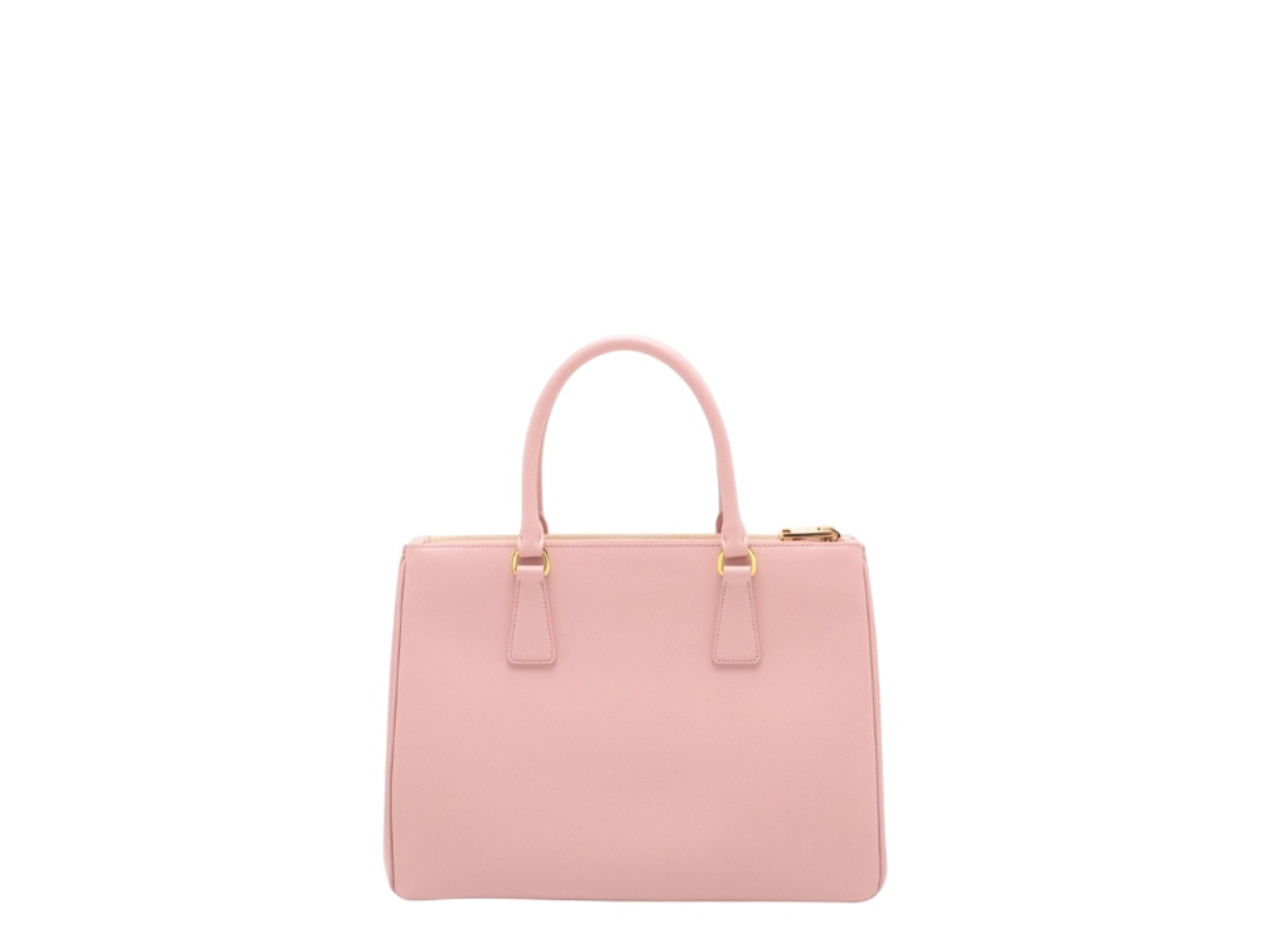 https://d2cva83hdk3bwc.cloudfront.net/prd-habbpsll2whp-prada-saffiano-lux-leather-2-way-handbag-pink-2.jpg