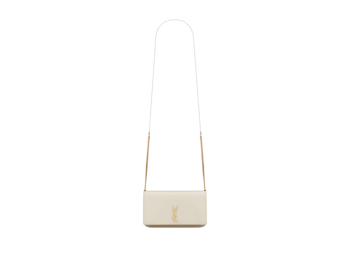https://d2cva83hdk3bwc.cloudfront.net/saint-laurent-cassandre-phone-holder-with-strap-in-smooth-leather-with-gold-toned-metal-hardware-blanc-vintage-2.jpg
