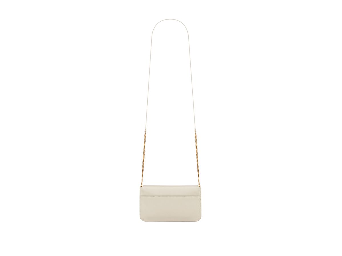 https://d2cva83hdk3bwc.cloudfront.net/saint-laurent-cassandre-phone-holder-with-strap-in-smooth-leather-with-gold-toned-metal-hardware-blanc-vintage-3.jpg