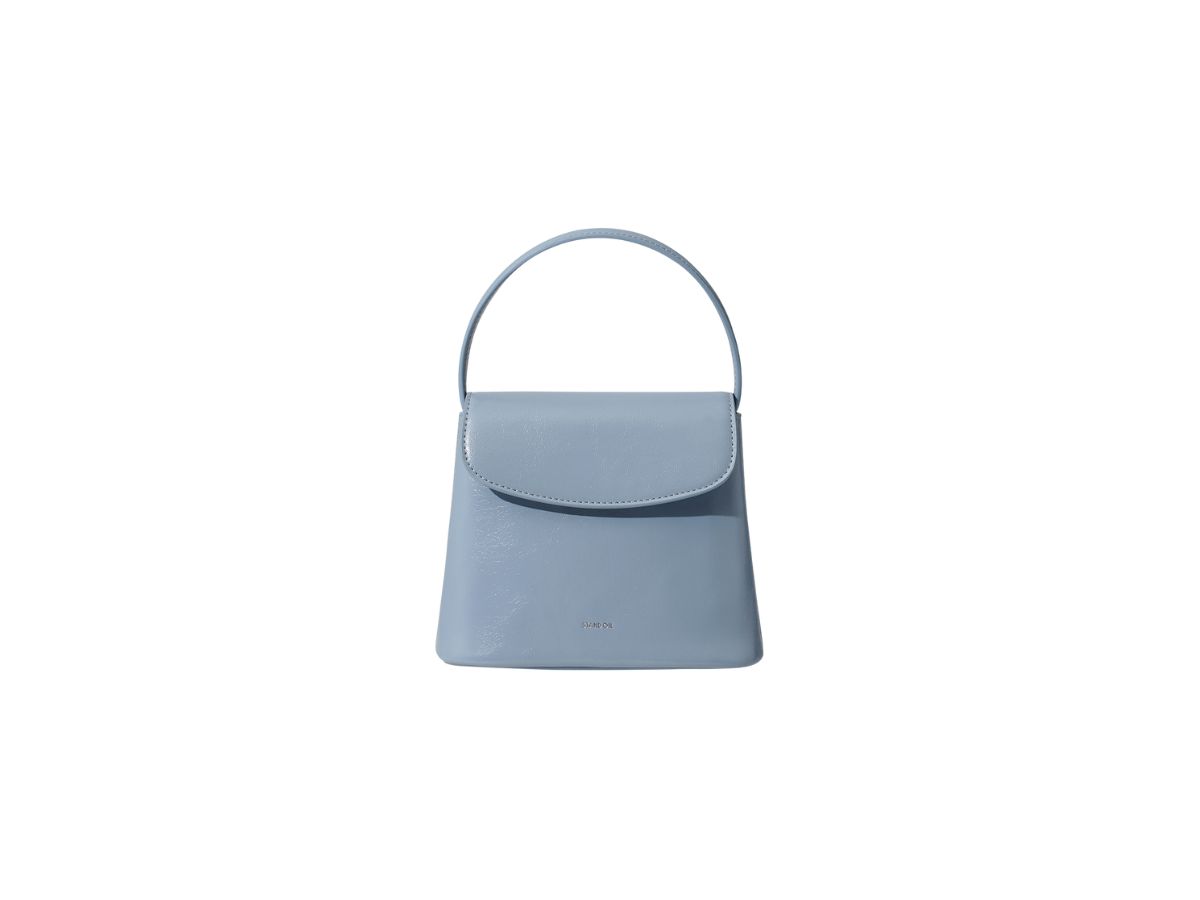 https://d2cva83hdk3bwc.cloudfront.net/stand-oil-coco-bag-in-vegan-leather-sky-blue-1.jpg