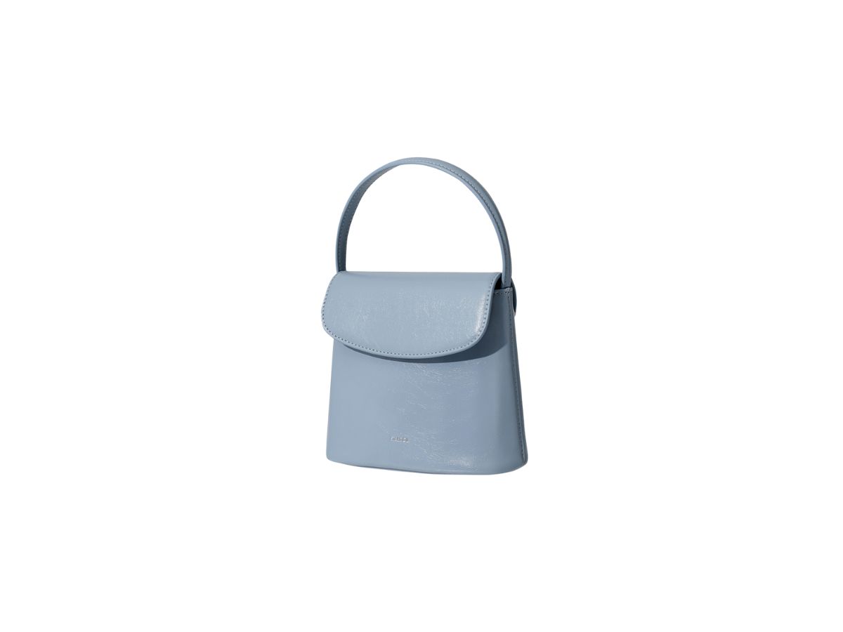 https://d2cva83hdk3bwc.cloudfront.net/stand-oil-coco-bag-in-vegan-leather-sky-blue-2.jpg