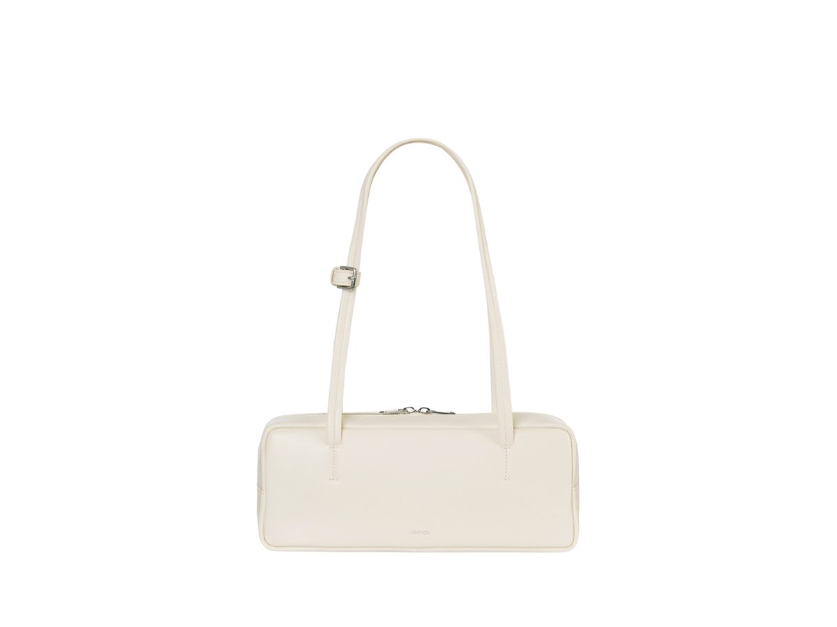 https://d2cva83hdk3bwc.cloudfront.net/stand-oil-more-baguette-bag-in-vegan-leather-cream-1.jpg