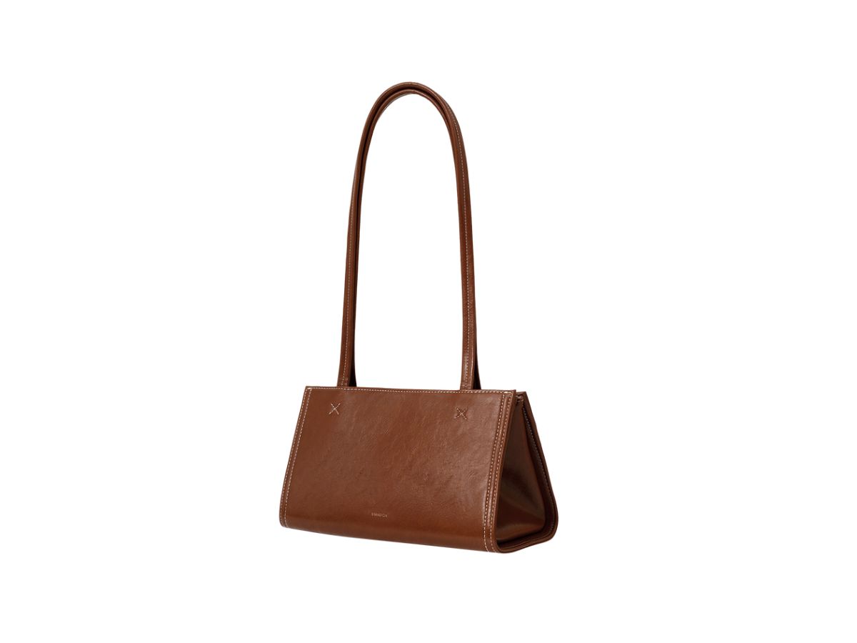 https://d2cva83hdk3bwc.cloudfront.net/stand-oil-oblong-bag-tiny-in-vegan-leather-brown-2.jpg