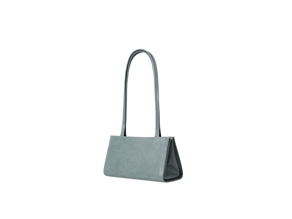 https://d2cva83hdk3bwc.cloudfront.net/stand-oil-oblong-bag-tiny-in-vegan-leather-denim-blue-2.jpg