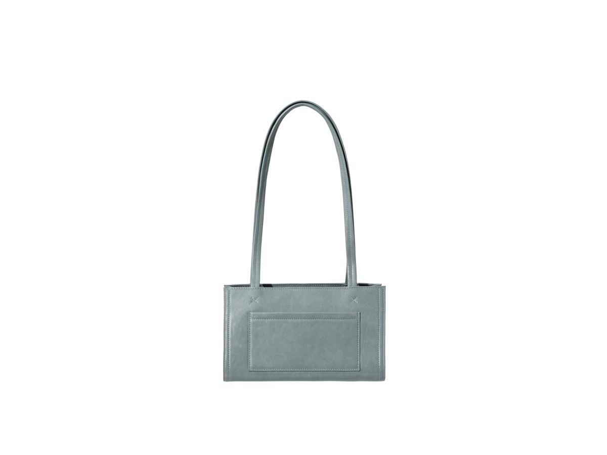 https://d2cva83hdk3bwc.cloudfront.net/stand-oil-oblong-bag-tiny-in-vegan-leather-denim-blue-3.jpg