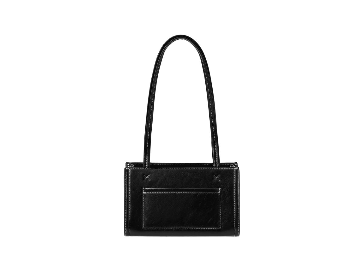 https://d2cva83hdk3bwc.cloudfront.net/stand-oil-oblong-bag-tiny-in-vegan-leather-stitch-black-3.jpg