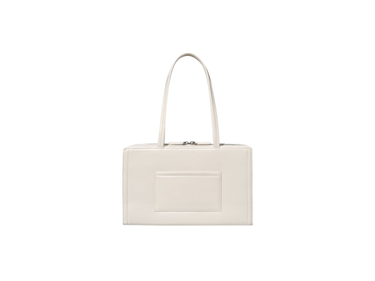 https://d2cva83hdk3bwc.cloudfront.net/stand-oil-post-bag-medium-in-vegan-leather-cream-3.jpg