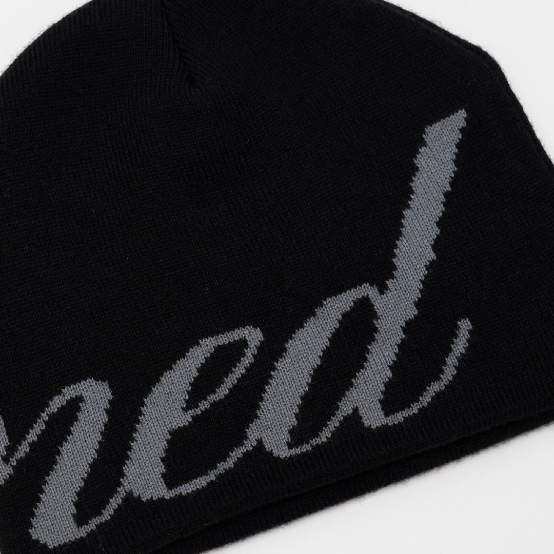 https://d2cva83hdk3bwc.cloudfront.net/stonedandco_void---cursive-logo-beanie-black-4.jpg
