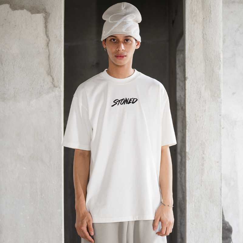 https://d2cva83hdk3bwc.cloudfront.net/stonedandco_wbb25--emblem-tee-white-3.jpg