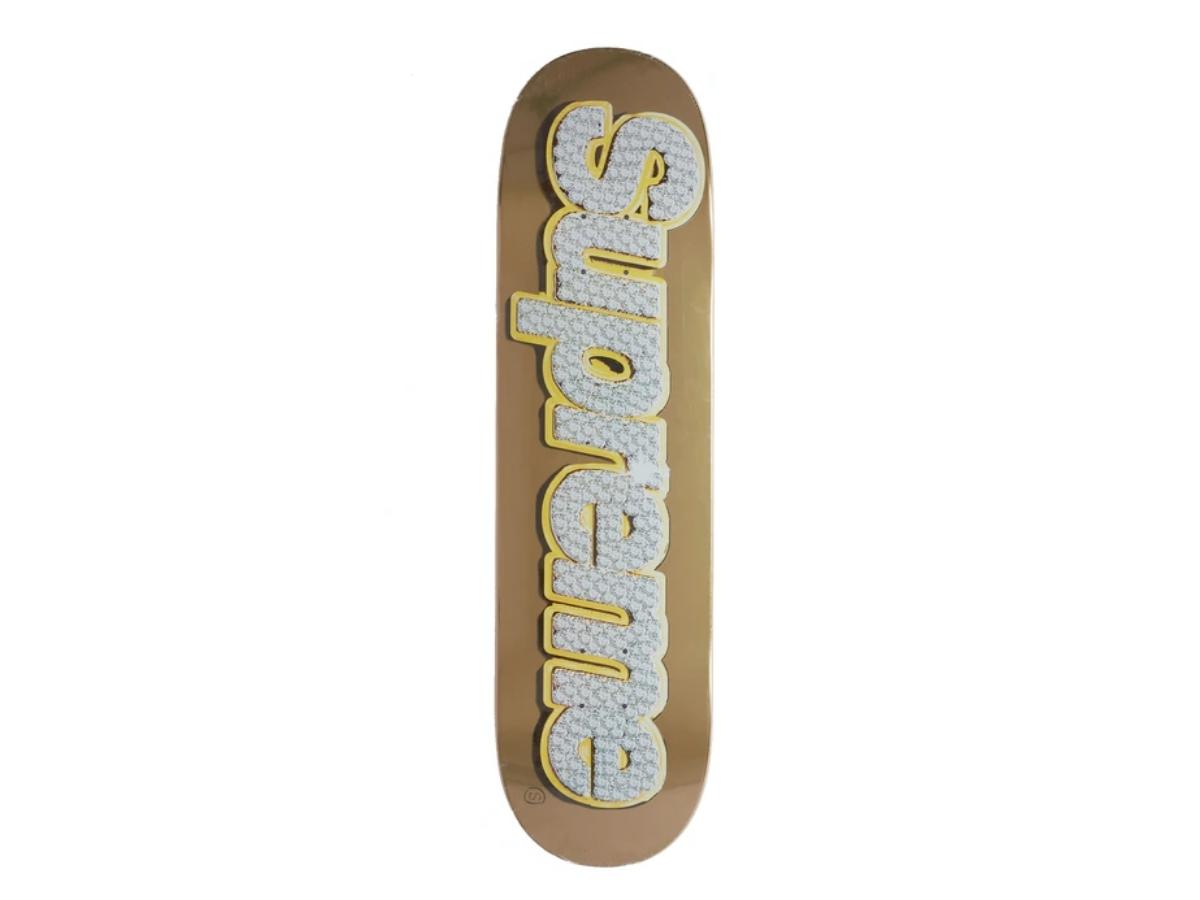 https://d2cva83hdk3bwc.cloudfront.net/supreme-bling-box-logo-skateboard-deck-gold-1.jpg