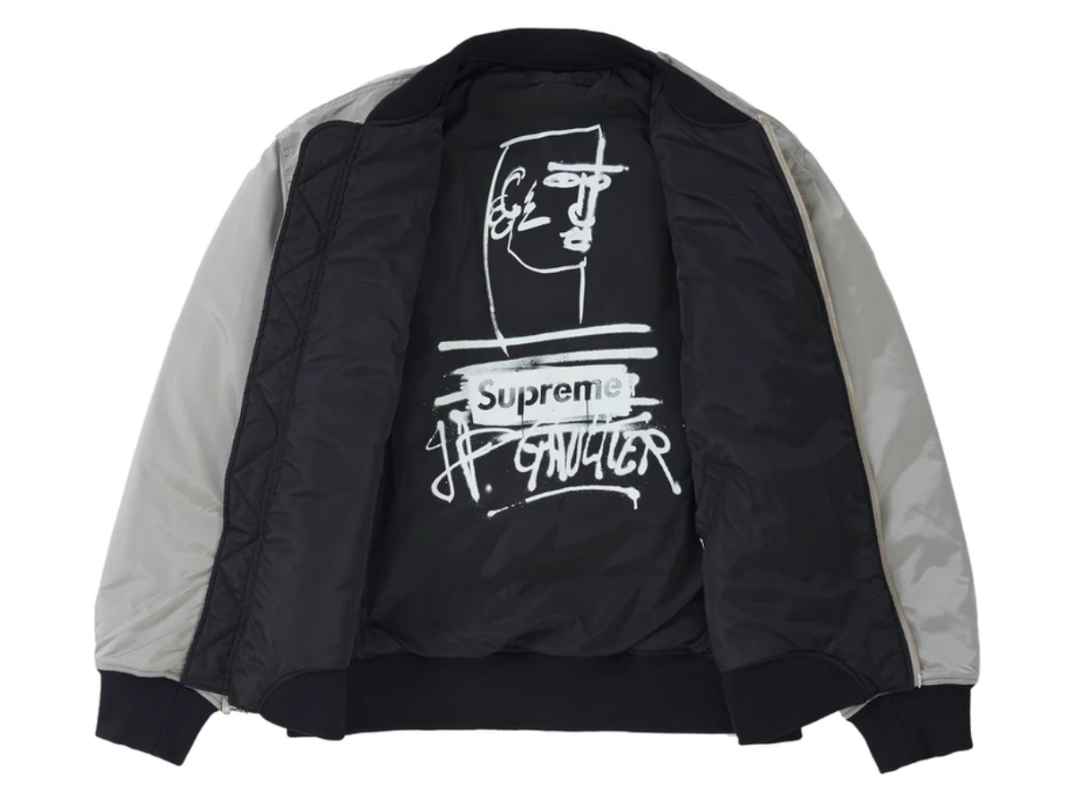 https://d2cva83hdk3bwc.cloudfront.net/supreme-jean-paul-gaultier-reversible-backpack-ma-1-silver-2.jpg