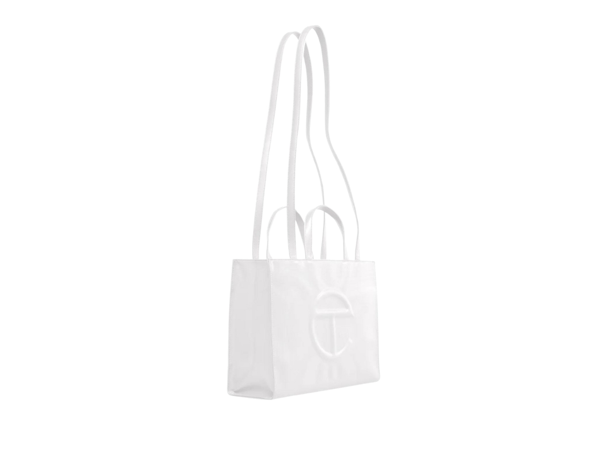 https://d2cva83hdk3bwc.cloudfront.net/telfar-medium-shopping-bag-in-faux-leather-white-2.jpg