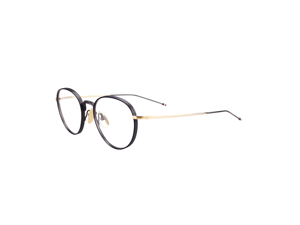 https://d2cva83hdk3bwc.cloudfront.net/thom-browne-tbx119-eyeglasses-in-titanium-frame-with-demo-lens-gold-3.jpg