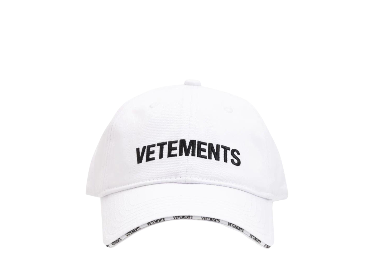 https://d2cva83hdk3bwc.cloudfront.net/vetements-logo-embroidered-cotton-twill-baseball-cap-white-1.jpg
