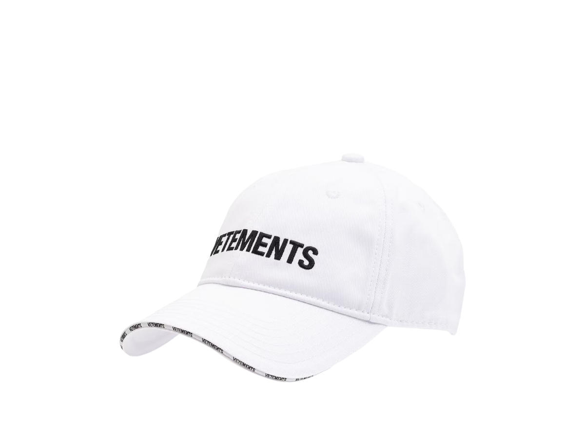 https://d2cva83hdk3bwc.cloudfront.net/vetements-logo-embroidered-cotton-twill-baseball-cap-white-3.jpg