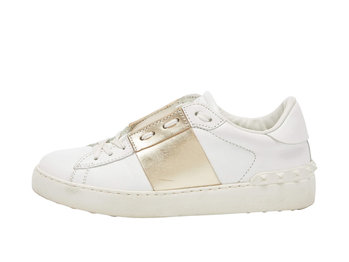 https://d2cva83hdk3bwc.cloudfront.net/vlt-snsvlrltoswg-valentino-leather-rockstud-low-top-open-sneakers-white-gold-2.jpg